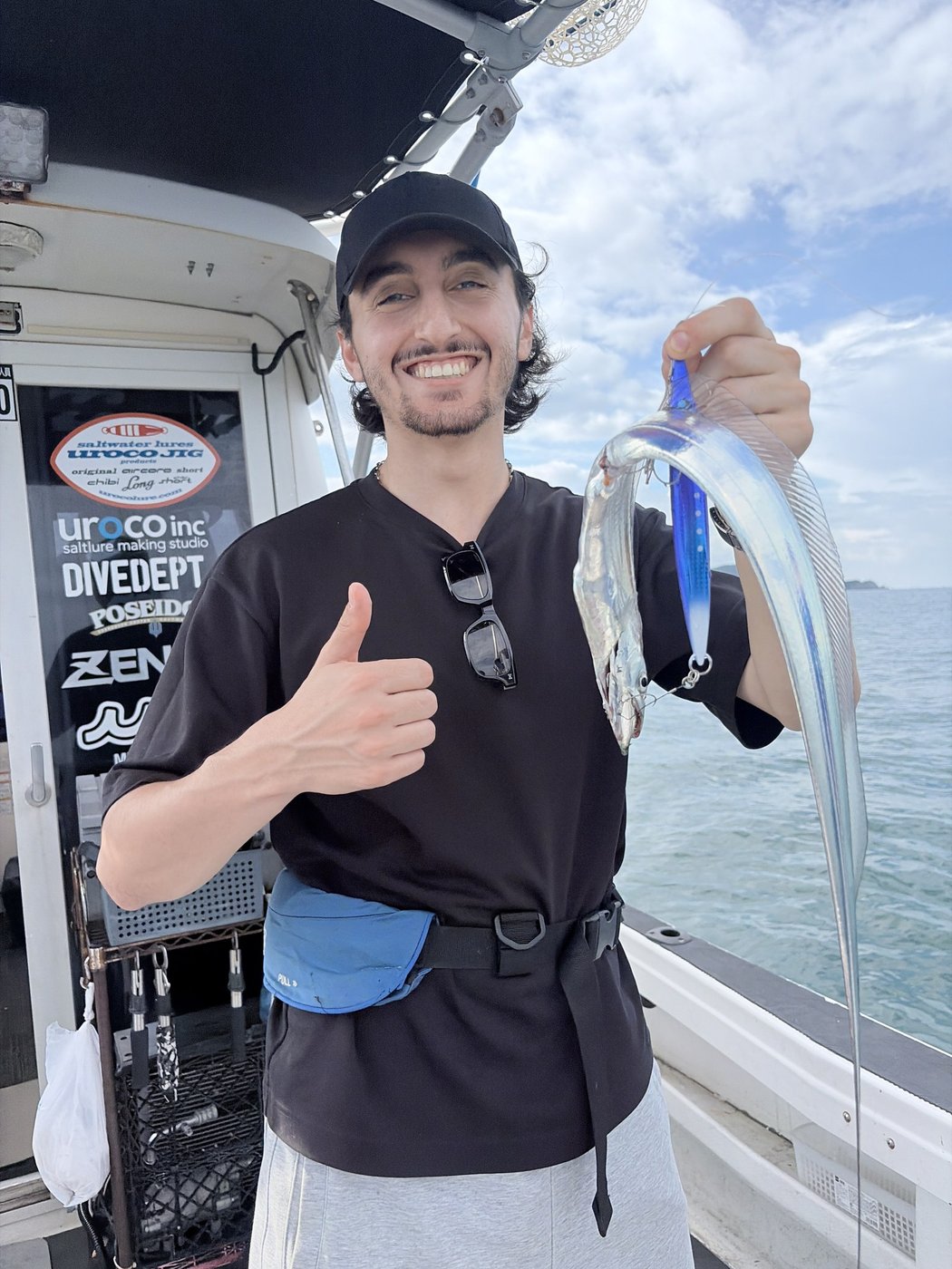 A guest with the first fish of the day