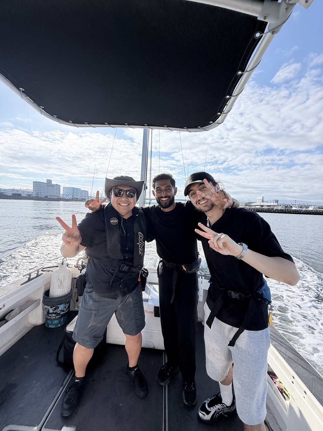 The captain and guests as the boat runs out
